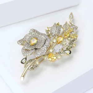 Close-up of a floral brooch with yellow zircon core and sparkling pavé petals