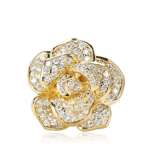 Luxurious gold rose brooch with sparkling cubic zirconia pavé setting on white background