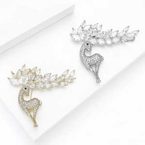 Elegant gold and silver reindeer brooches set with sparkling cubic zirconia stones