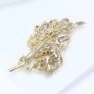 Detailed back view of rose brooch showing the secure pin clasp and gold metal plating