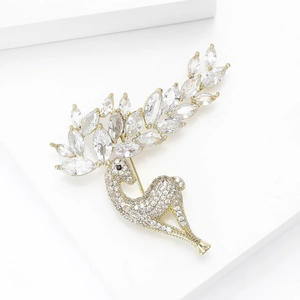 Exquisite detail of a gold deer brooch featuring inlaid zircons and marquise crystals