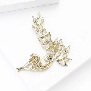 Exquisite golden deer brooch with shimmering cubic zirconia on white geometric background