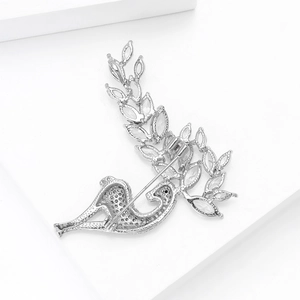 Detailed back view of a silver deer brooch showing the secure pin and zircon setting