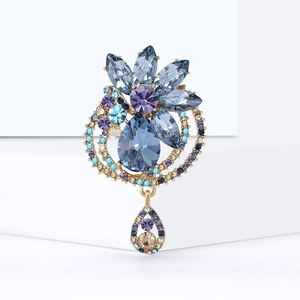 Elegant gold-tone crystal flower brooch with blue and purple teardrop stones for dresses