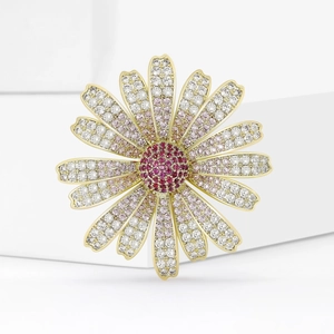 Elegant daisy brooch with gradient zircon crystals on a minimalist white display