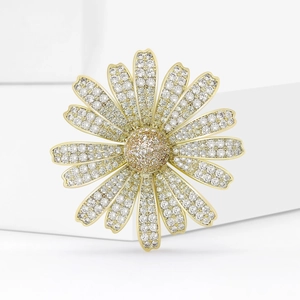 Elegant gold daisy brooch with sparkling zircon petals and champagne crystals