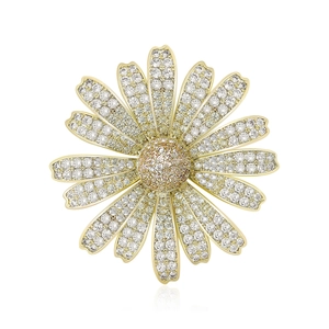 Elegant gold daisy brooch with white zircon petals and champagne stone center on white background