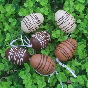 Set of 6 striped Easter egg ornaments with ribbons nestled in green grass decor