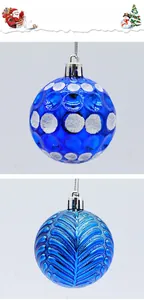 Detail of blue Christmas balls with silver glitter dots and leaf textures for tree decoration