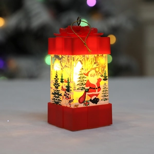 Red Christmas lantern with Santa and reindeer scenes glowing in warm yellow light