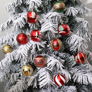 Set of 6 festive 8cm hand-painted Christmas balls in red, gold and green on a white tree