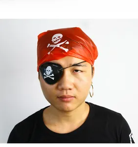 Close-up of pirate costume set with red skull bandana, black eye patch and gold earring
