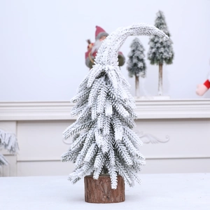 Mini sapin de Noël enneigé avec cime courbée et base en bois naturel massif