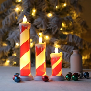Three-piece LED flickering tea lights with red and white candy cane stripes and wax drip effect