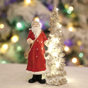 Christmas Santa figurine and glittery tree decoration with warm LED lights for home decor