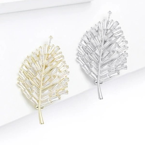 Elegant leaf brooches with gold and silver plating and baguette-cut cubic zirconia
