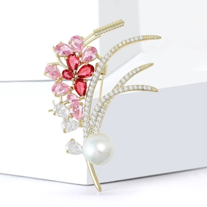 Elegant gold wheat brooch with pink zircon flower petals and a large white pearl accent