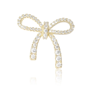 Elegant gold bow brooch with sparkling crystals and minimalist design for women