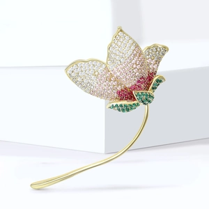 Elegant gold flower brooch with gradient pave zircon stones and delicate curved stem