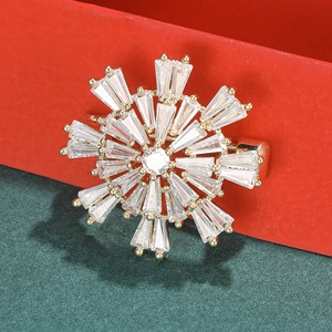 Fashionable snowflake brooch with sparkling cubic zirconia on a gold base for women