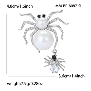 Sparkling spider brooch with white pearls and clear zircons in silver finish for suits