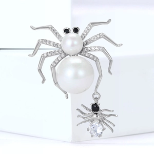 Spider brooch with white pearls and sparkling zircon stones for suit jackets and blazers