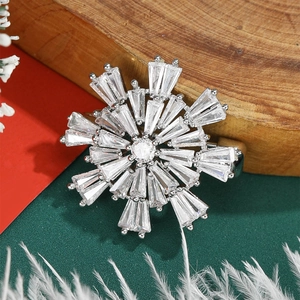 Sparkling snowflake brooch with micro-pave zircons on a silver metal base for women