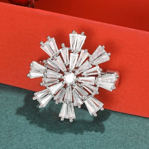 Fashionable snowflake brooch with sparkling cubic zirconia in silver metal setting