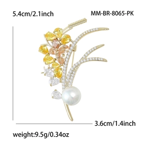 Elegant gold wheat brooch with cubic zirconia crystals and a white pearl accent