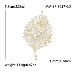 Elegant gold leaf brooch with baguette-cut zircons for suits, size 5.8cm by 3.2cm