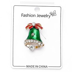 Detail of Christmas bell brooch with green enamel, red bow, and sparkling crystals