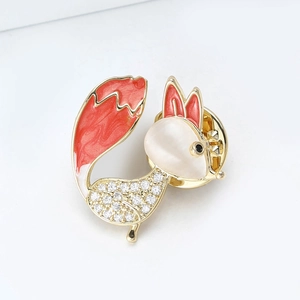 Charming gold fox brooch with red enamel tail and sparkling white zircon stones