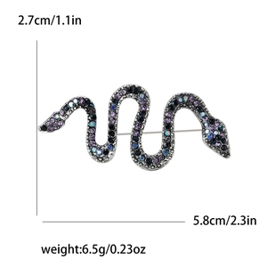Detailed view showing dimensions of a silver-tone snake brooch with purple rhinestones
