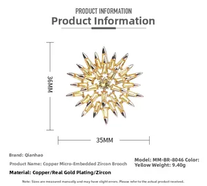 Detail shot of a champagne gold starburst brooch with micro-pave cubic zirconia stones