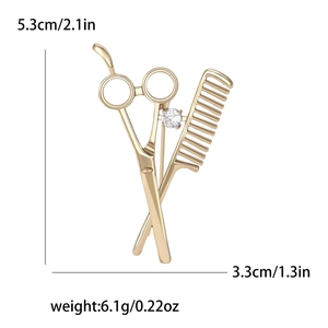 Broche ciseaux et peigne plaquée or avec zircon et indications de dimensions