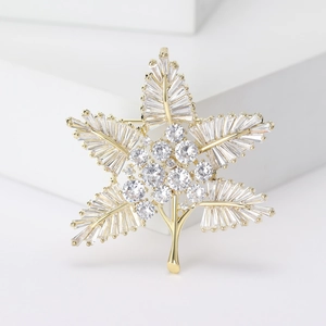 Elegant gold maple leaf brooch with micro-paved zircons for minimalist suit styling