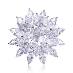 Detailed macro view of marquise-cut zircon snowflake brooch with silver-toned flower petals
