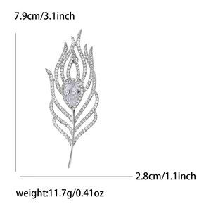 Detail view of crystal feather brooch showing 7.9cm height and 2.8cm width dimensions