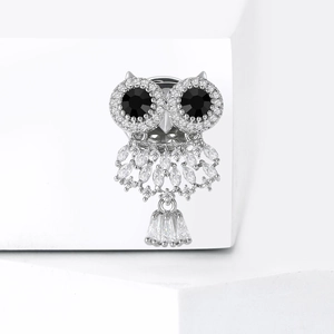 Elegant owl brooch with black gem eyes and sparkling cubic zirconia dangling pendant