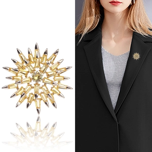 Sparkling yellow sunburst snowflake brooch with zircon stones in a silver alloy frame