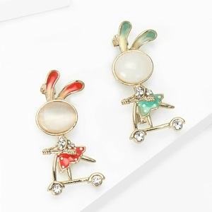 Cute bunny on scooter brooch set with white cat eye stone and colorful enamel finish