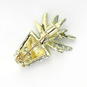 Golden pineapple enamel pin with small white rhinestones and a secure safety pin backing