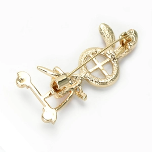 Detailed back view of the golden metal rabbit brooch featuring a secure pin clasp mechanism