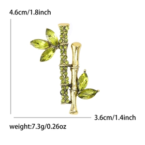 Bamboo shaped alloy brooch with green crystals and rhinestones for women 4.6cm size