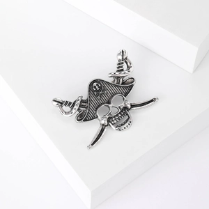 Vintage silver pirate skull brooch with cross swords and hat on a minimalist base