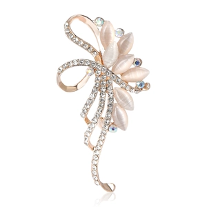 Eleganter Schleifen-Brosche aus Goldlegierung mit Katzenaugensteinen und Strass