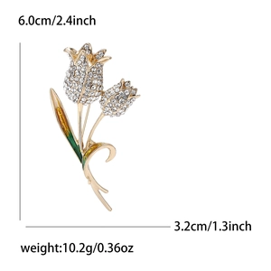 Elegant gold tulip brooch with sparkling rhinestones and green enamel details