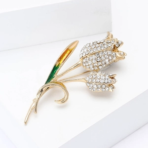 Elegant tulip brooch with sparkling rhinestones and green enamel on a gold base