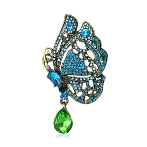 Broche papillon vintage avec strass bleus et verts et un pendentif en forme de poire