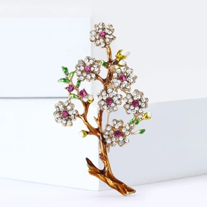 Elegant gold flower branch brooch with pink rhinestones and green enamel leaves